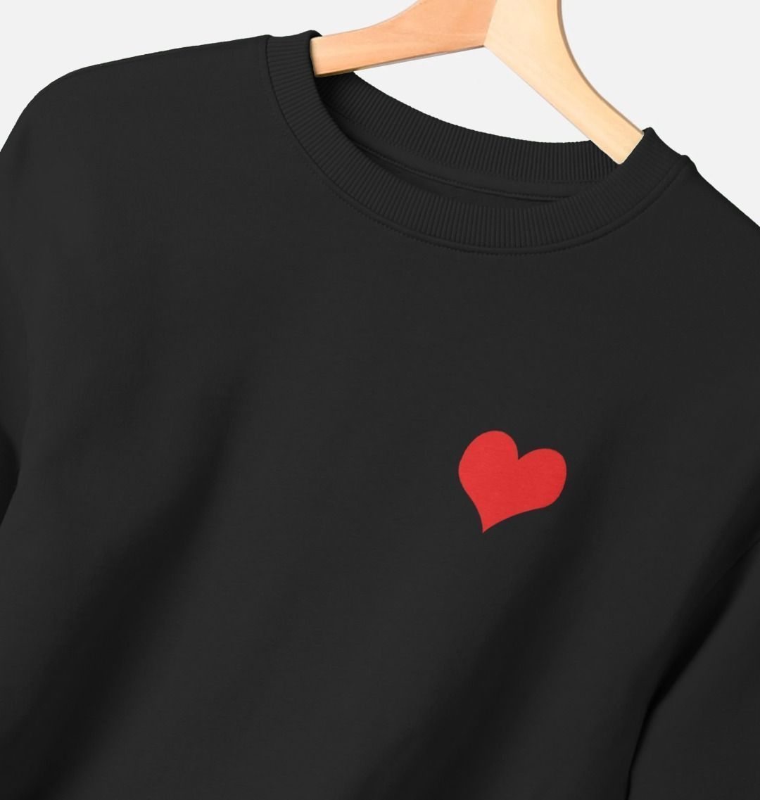 Black boxy fit cotton sweatshirt with small red heart graphic on upper left chest