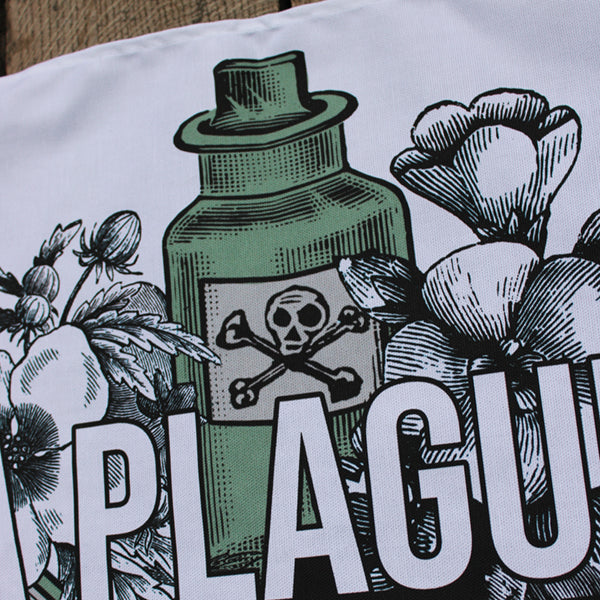 White kitchen towel printed with a design of flowers and green poison bottles