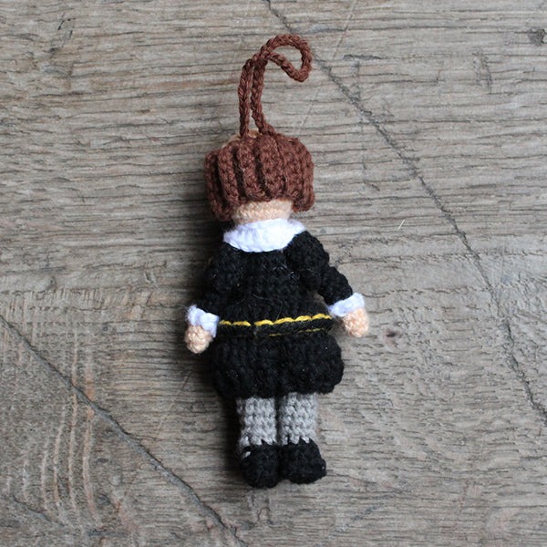 Crocheted Shakespeare decoration wearing a black doublet and hose with grey stockings