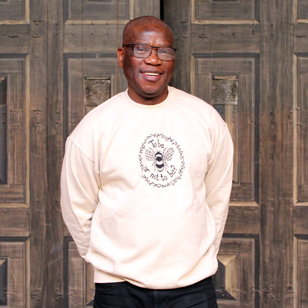 Sand coloured unisex sweatshirt with bee graphic black print in centre front