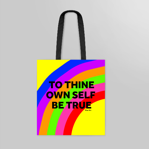 Rainbow coloured tote bag with black handles and text