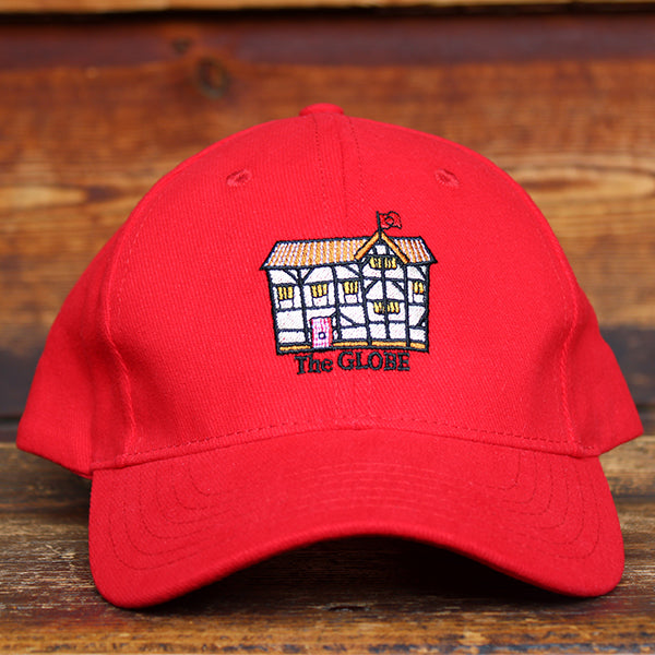 Red cotton baseball cap with curved bill and embroidered cartoon Shakespeare's Globe on front