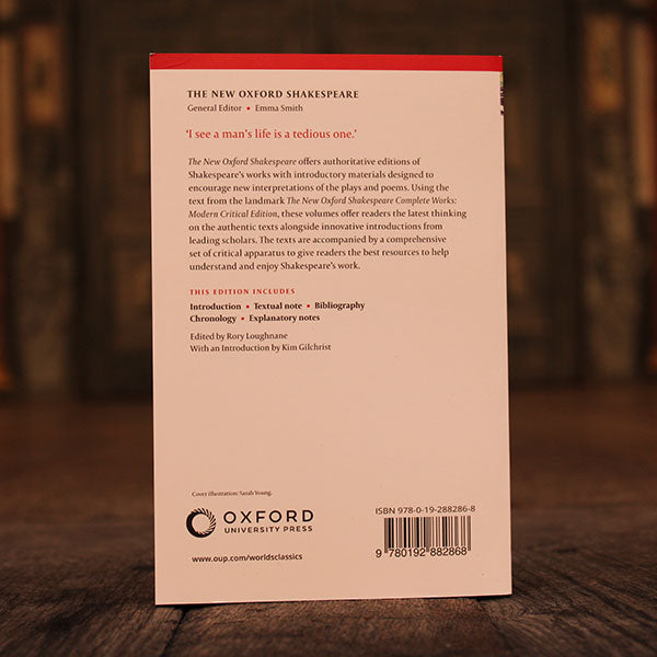 Back of paperback book, white with black and red text and red band at the top