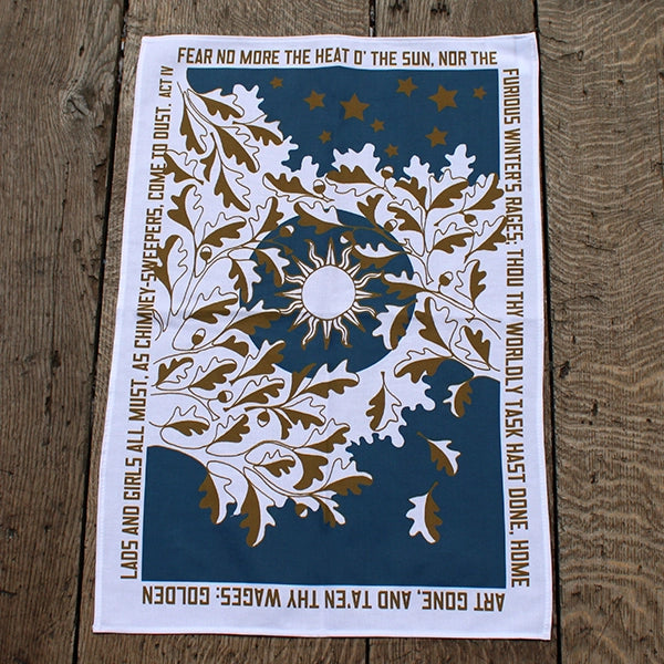 White cotton tea towel with all over teal and copper sun amongst leaves print