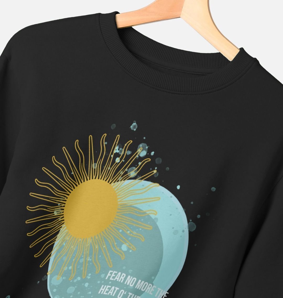 Black sweatshirt with sun and moon blue and yellow graphic with white text overlay