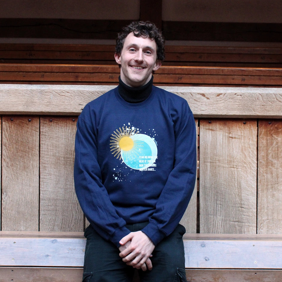 Navy blue sweatshirt with sun and moon blue and yellow graphic with white text overlay
