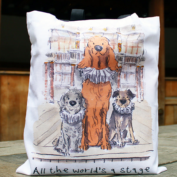 White cotton tote bag with black straps and graphic of 3 dogs in ruffs on Globe stage
