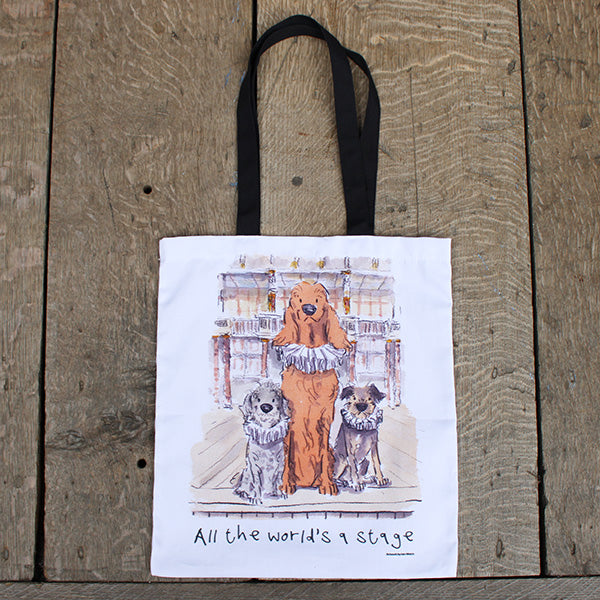 White cotton tote bag with black straps and graphic of 3 dogs in ruffs on Globe stage