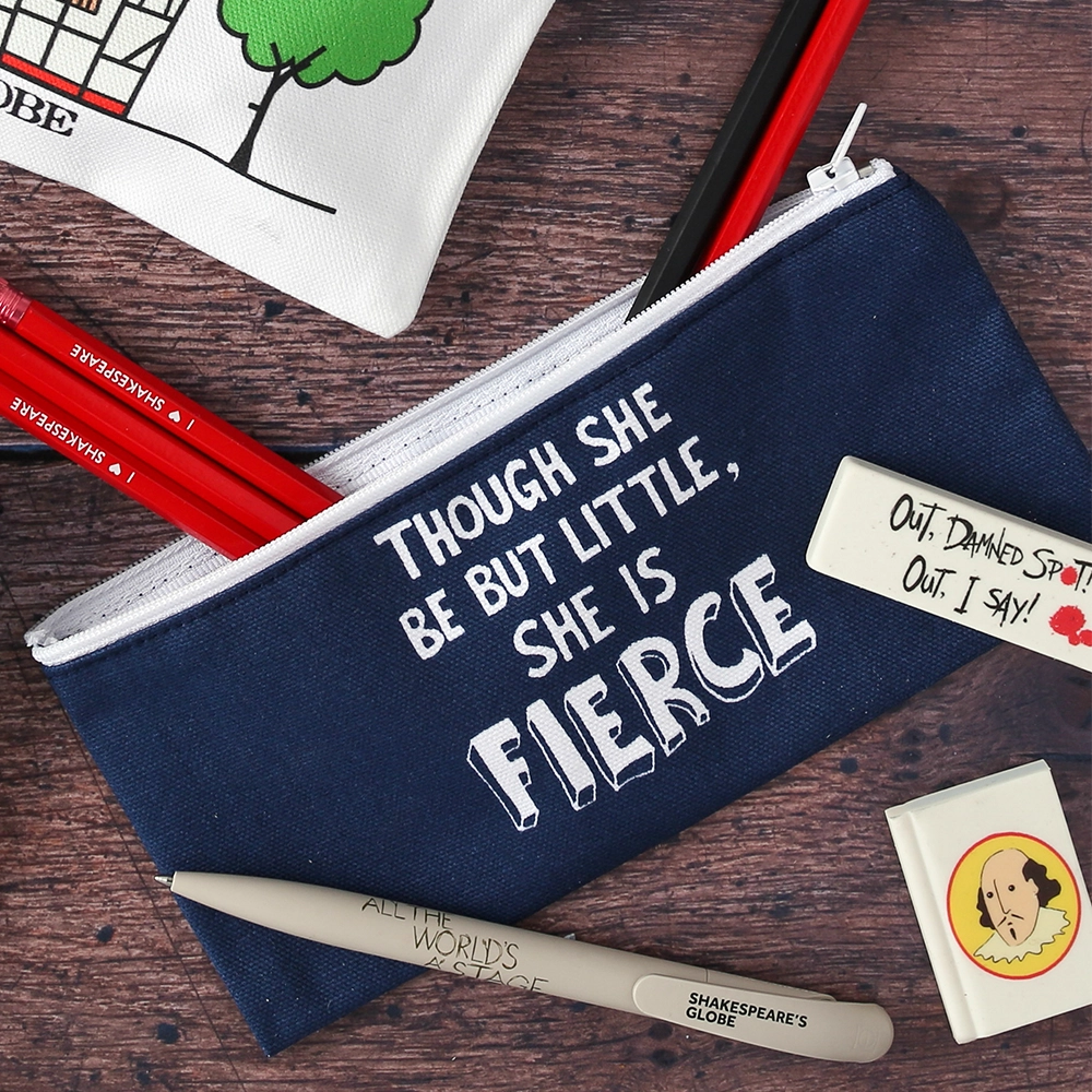 A mid-blue cotton pencil case with a white zip. The pencil case is printed on both sides with a quote from Shakespeare play, A Midsummer Night's Dream (though she is but little, she is fierce) in white hand-drawn capital letters.