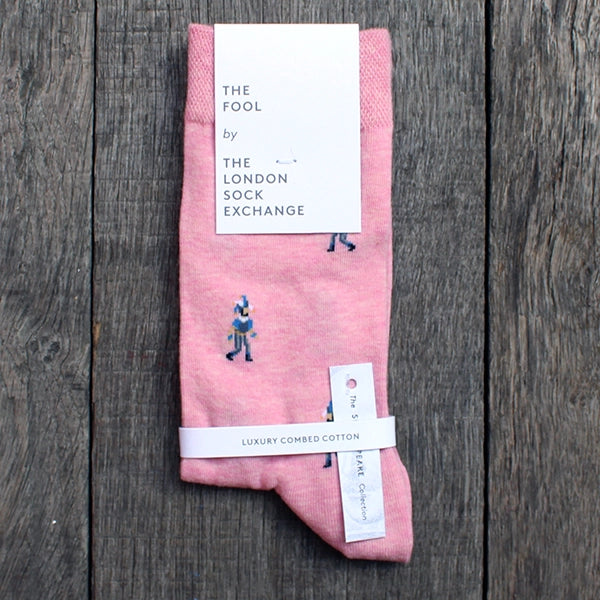 Pale pink cotton blend socks with fool character repeat pattern approximately 1 inch between each character, packaged in white card