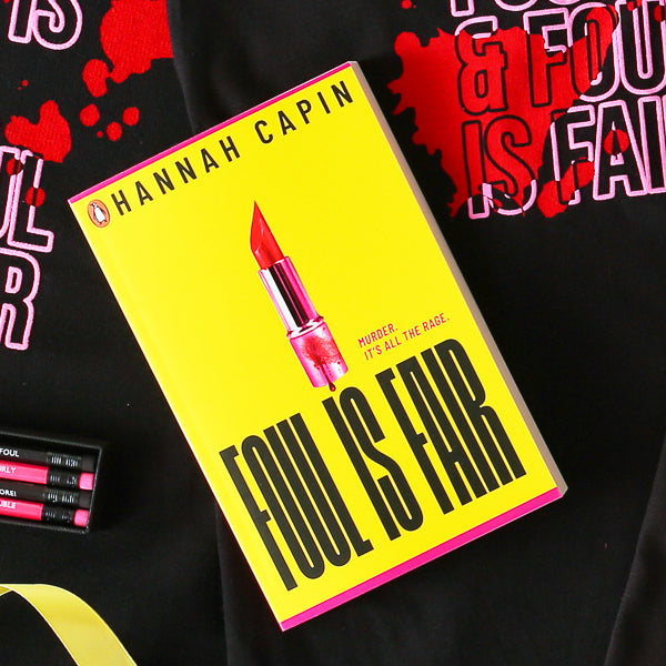 Canary yellow paperback book with bold black text and hot pink lipstick on the centre front with blood dripping on it