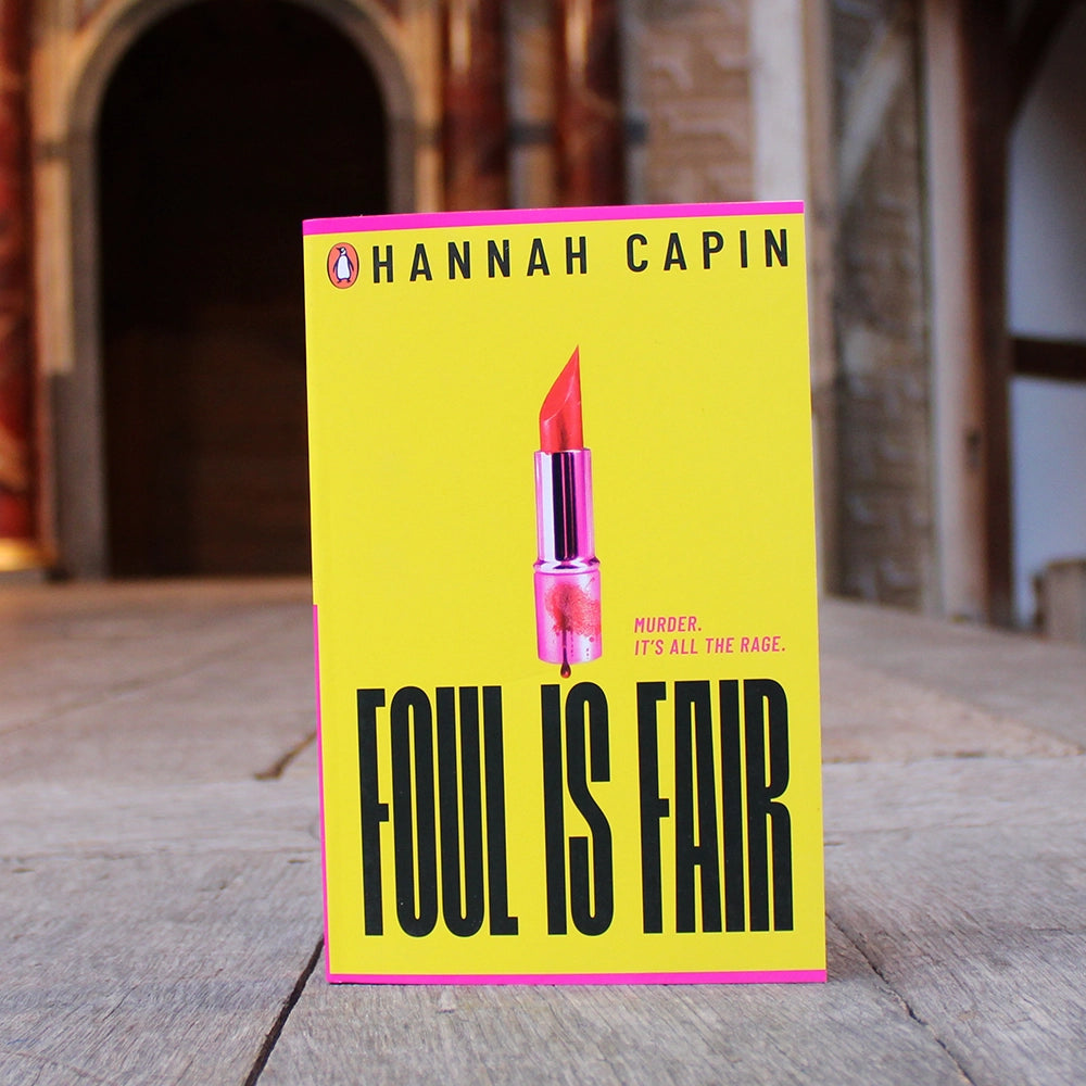 Canary yellow paperback book with bold black text and hot pink lipstick on the centre front with blood dripping on it
