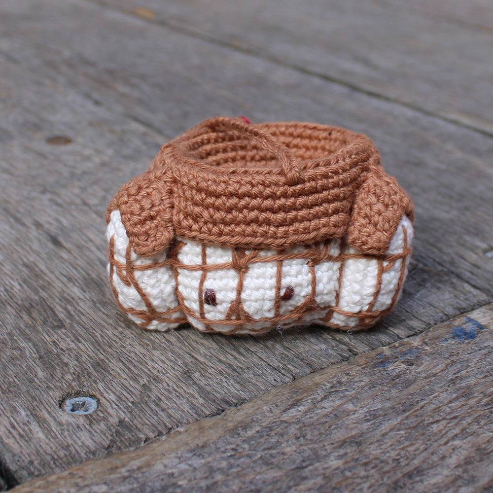 Brown and white crochet Shakespeare's Globe Christmas decoration with centred string for hanging on a tree