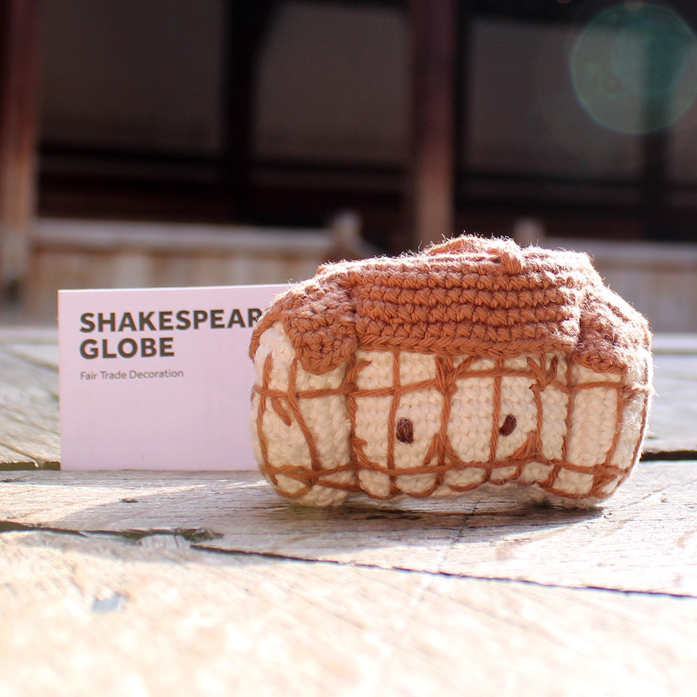 Brown and white crochet Shakespeare's Globe Christmas decoration with centred string for hanging on a tree, with white card