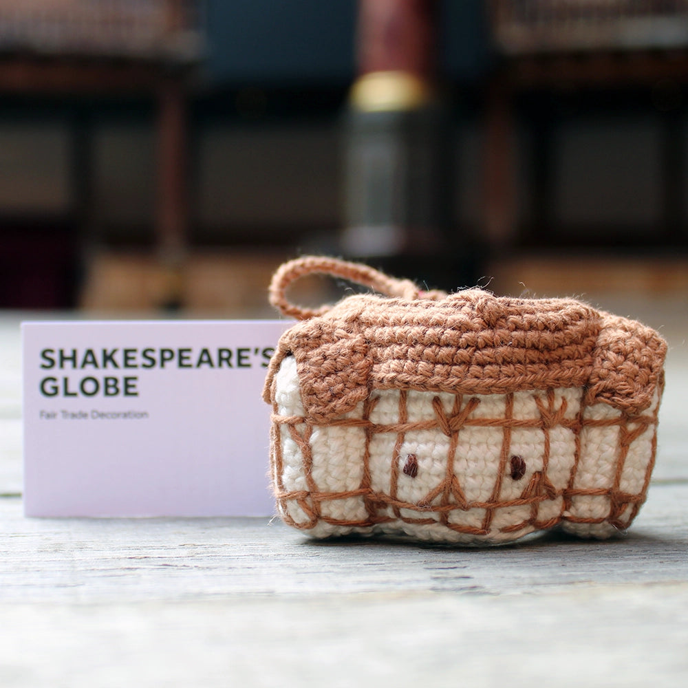 Brown and white crochet Shakespeare's Globe Christmas decoration with centred string for hanging on a tree, with white card