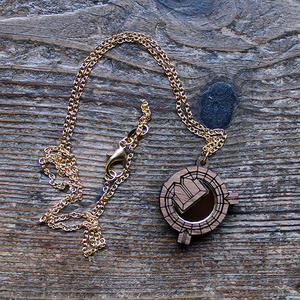 Walnut wood necklace in the shape of an architectural plan on a gold-coloured chain
