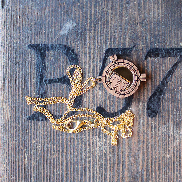 Walnut wood necklace in the shape of an architectural plan on a gold-coloured chain