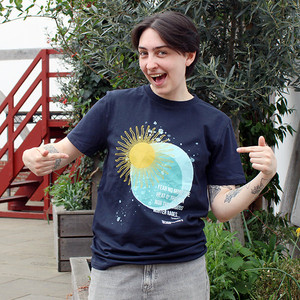 Navy blue t-shirt with pale blue moon and yellow sun graphic with white text