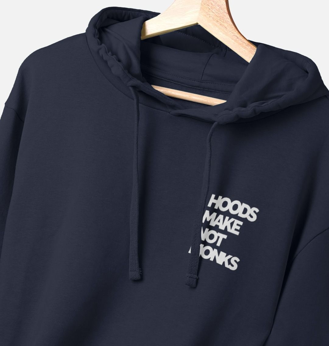 Navy blue cotton hoodie with front pockets and a print on the upper left chest of a quote in heavy white text