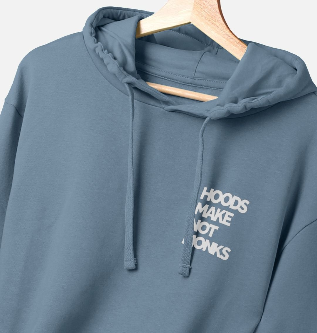 Mid blue cotton hoodie with a print on the upper left chest of a quote in heavy white text