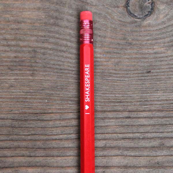 Red pencil with red eraser and white stamped text