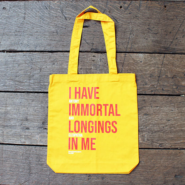 yellow bag with an orange and white text print