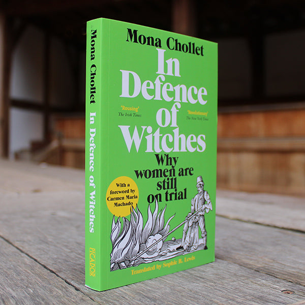 Green paperback book with black and white text, featuring black and white image