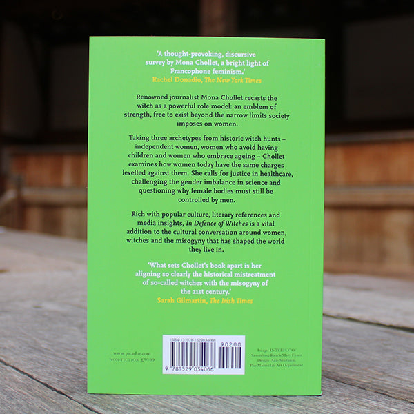 Green paperback book with black and white text, book back