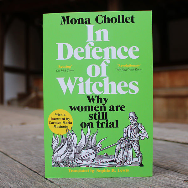 Green paperback book with black and white text, featuring black and white image