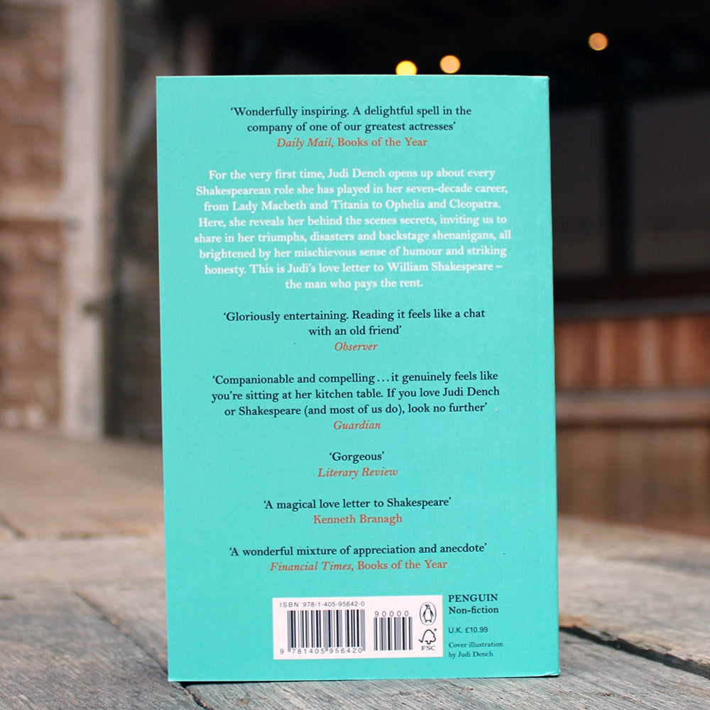 Teal paperback book with copper and black script writing