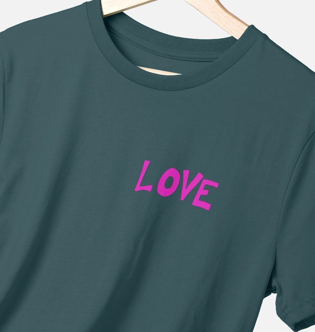 Teal t-shirt with hot pink graphic style quote text on upper left chest