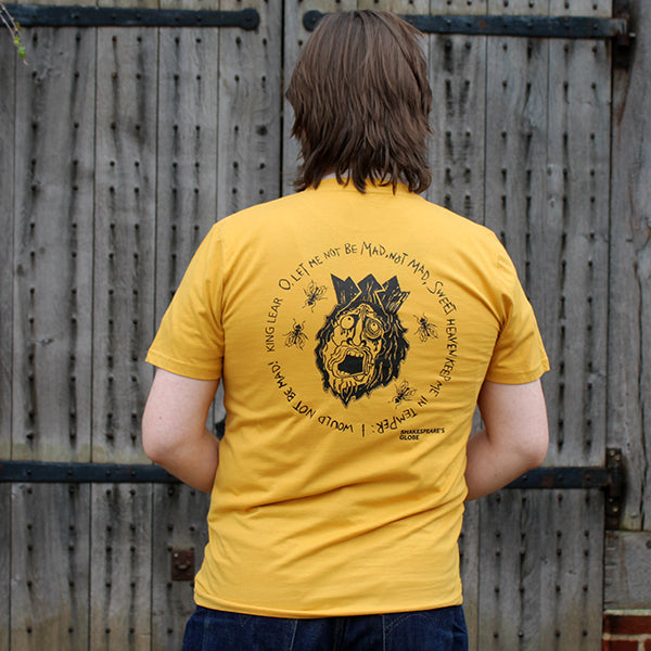 Yellow standard fit t-shirt back with large graphic of rotting king lear face, with a crown on his head, flies buzzing all around, with stylized text surrounding graphic in a circle