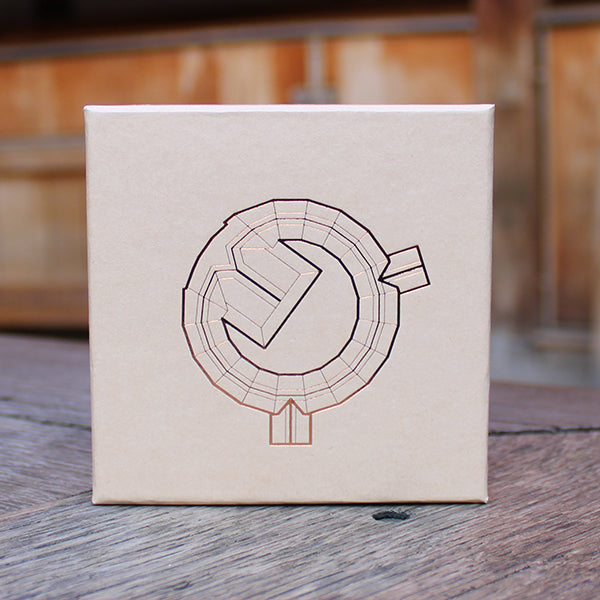Kraft gift box with a fine-line print on the lid in gold