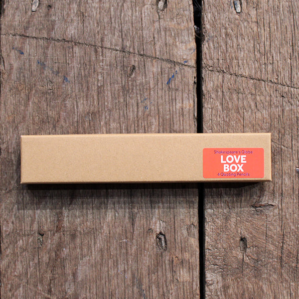 Kraft pencil box containing 4 love quote pencils, with red 'Love Quotes' sticker on bottom right of box