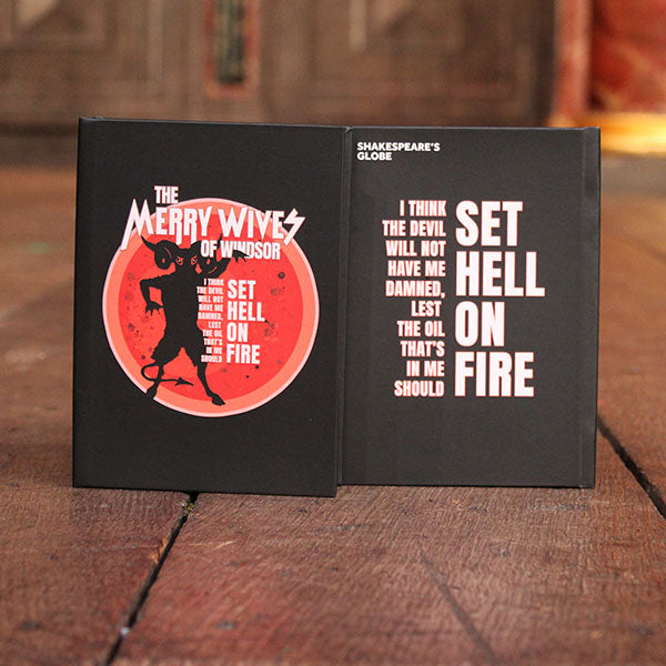 black hardback journal with a red and white print to the cover