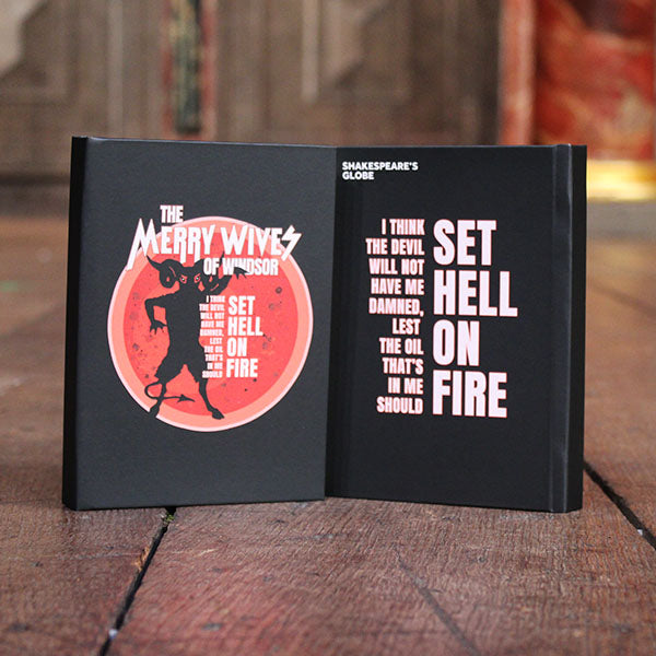 black hardback journal with a red and white print to the cover