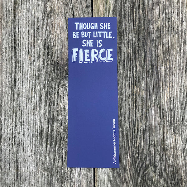 Blue bookmark with text on a wooden surface