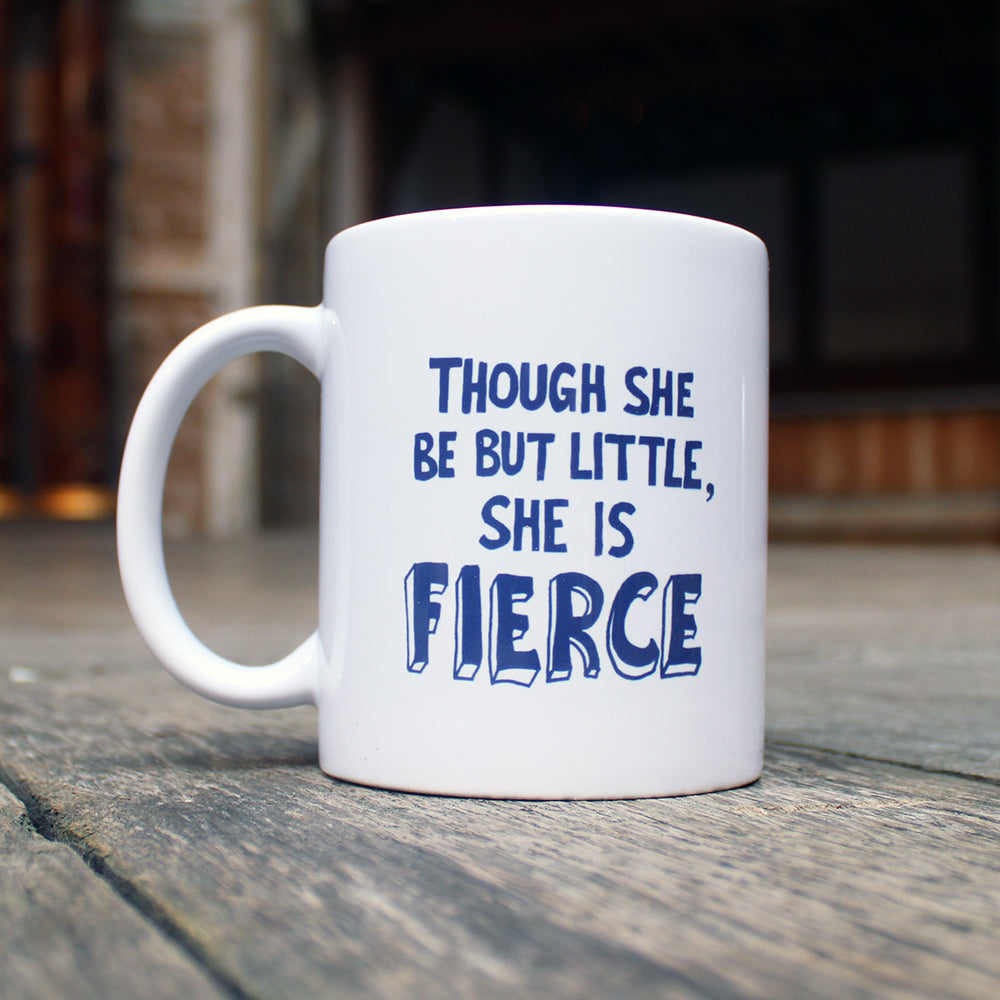 White mug with dark blue stylised 'fierce' quote graphics on either side