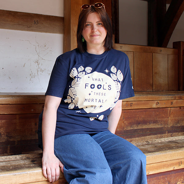 Navy blue cotton short sleeve t-shirt with white graphic text in centre