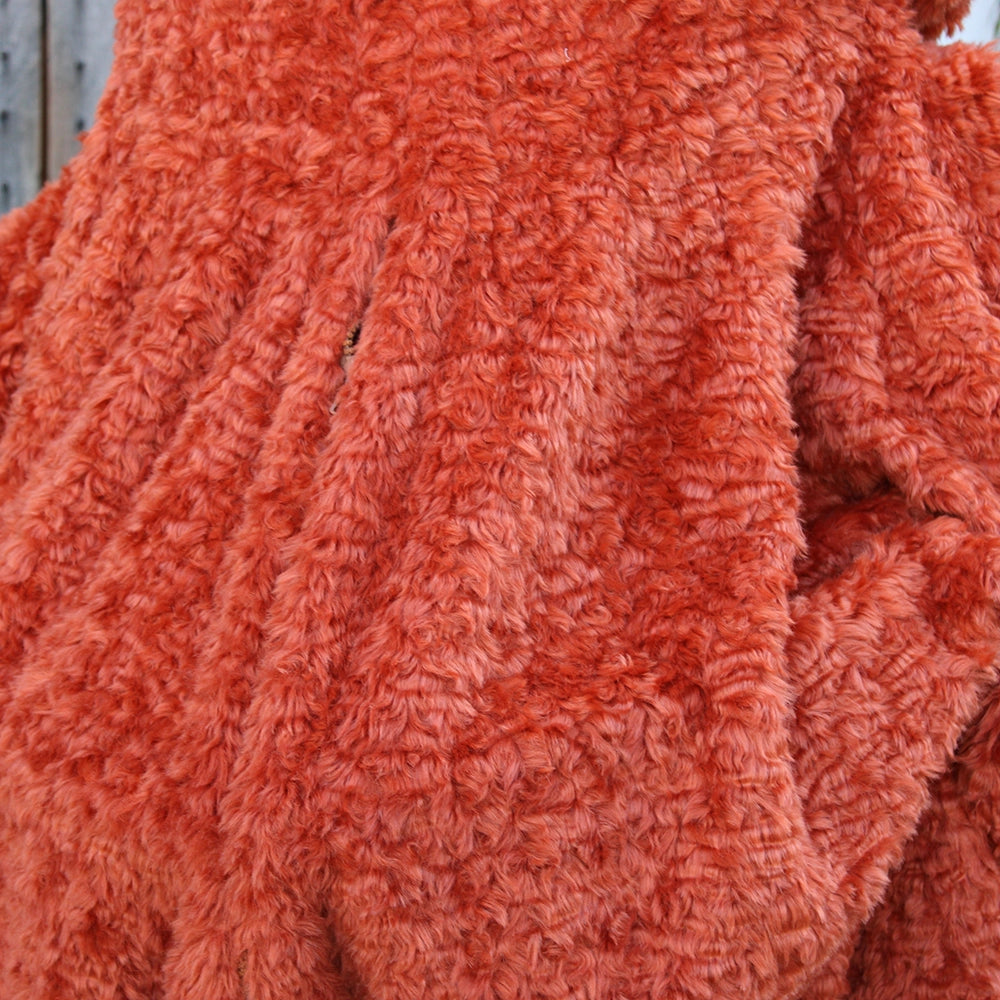 Burnt orange monster costume with oversized head