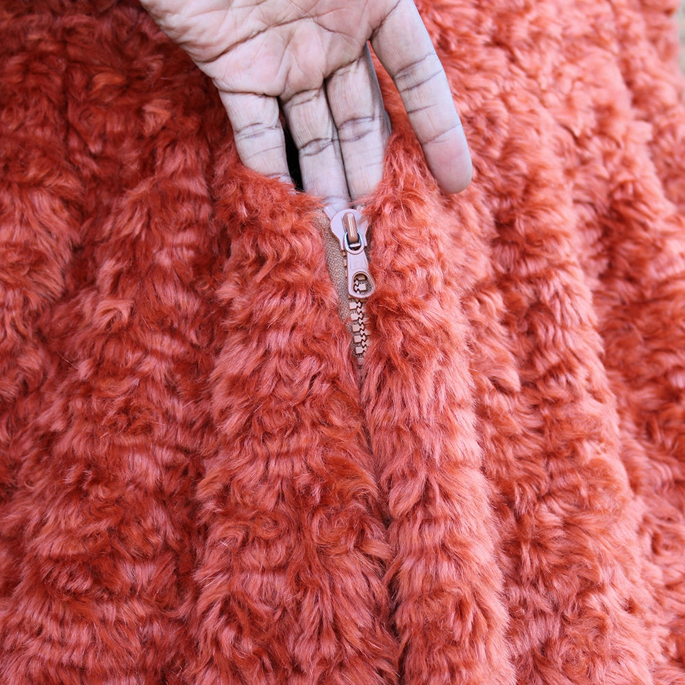 Burnt orange monster costume with oversized head