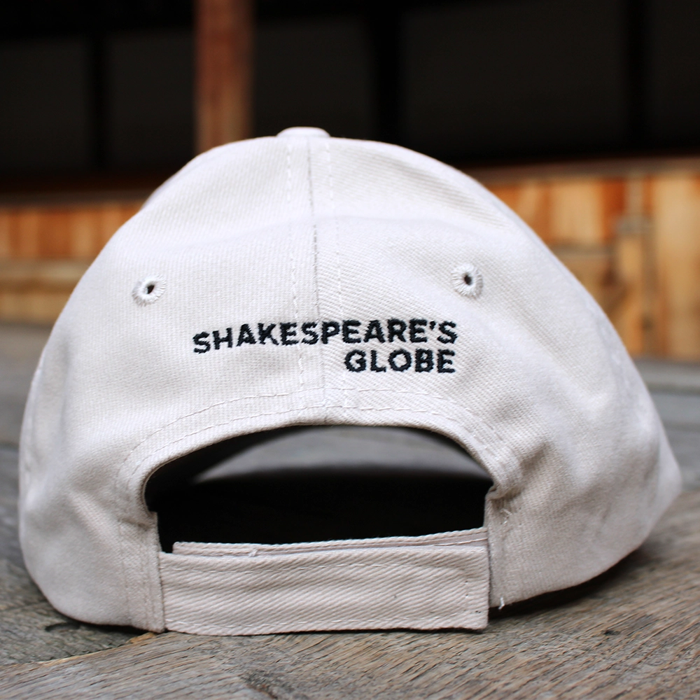 Sand coloured cotton baseball cap with black text embroidered on the back and Velcro adjustable closure