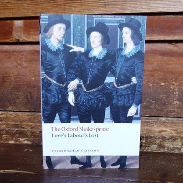Paperback book featuring 3 men in black hats, doublets, trousers and general Elizabethan garments