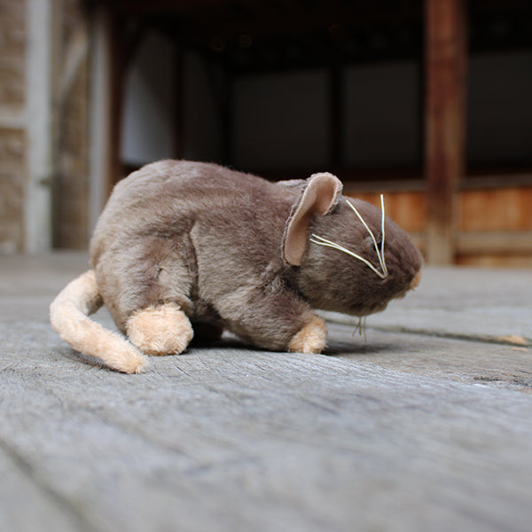 Pale brown soft toy in a rat shape with beige feet, tale, nose and inner ears