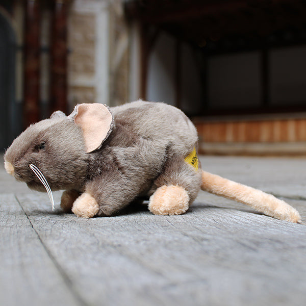 Pale brown soft toy in a rat shape with beige feet, tale, nose and inner ears