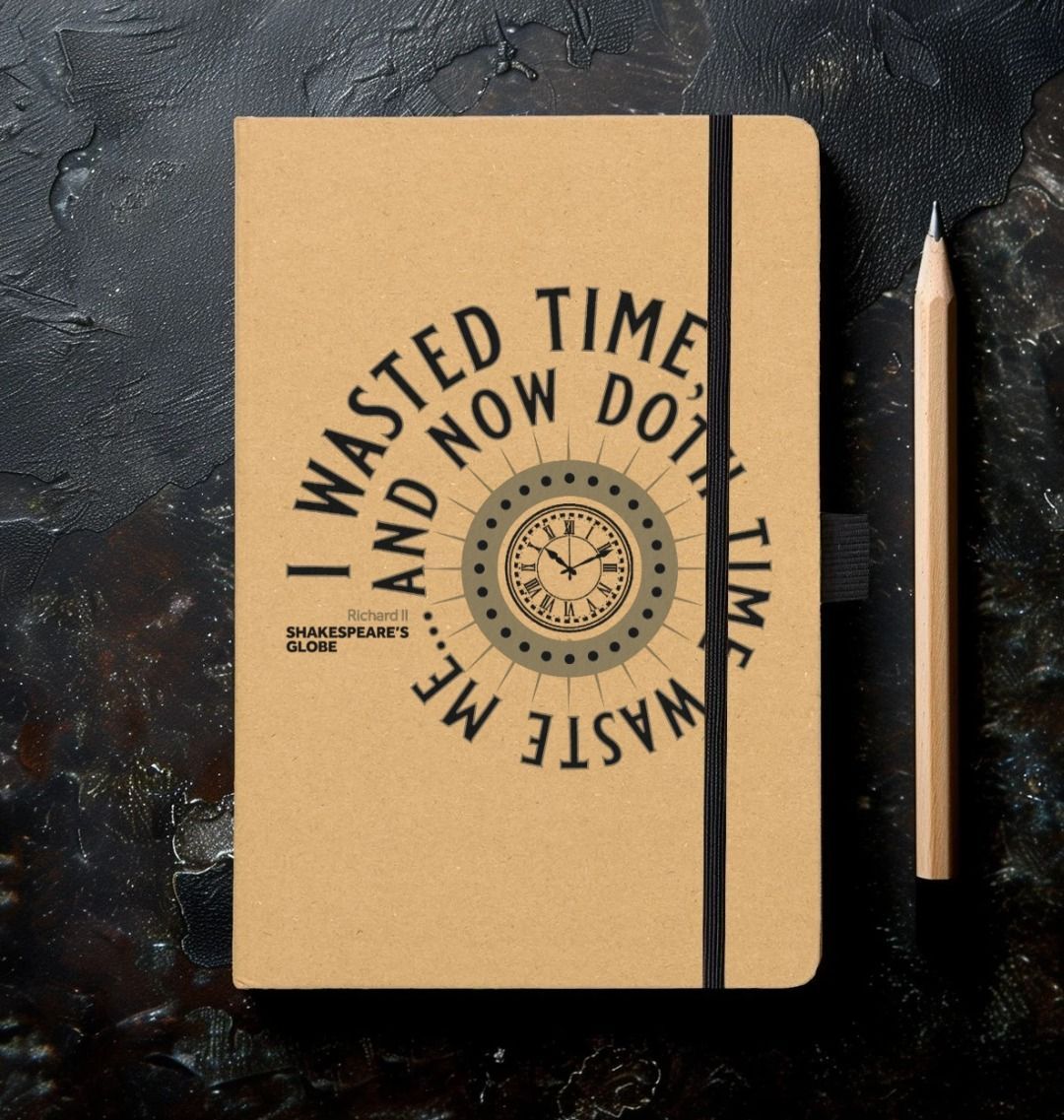 notebook with a kraft paper cover and a print of words circled around a clock face