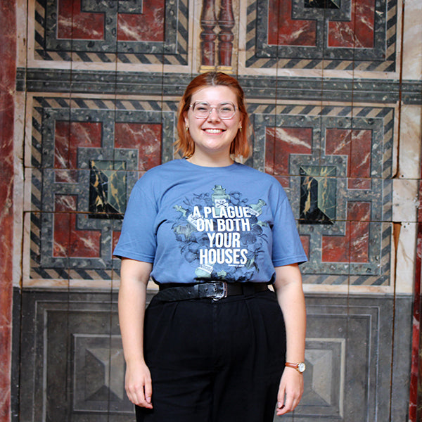 Pale blue t-shirt with white, grey blue and dark blue graphic in centre with white graphic text