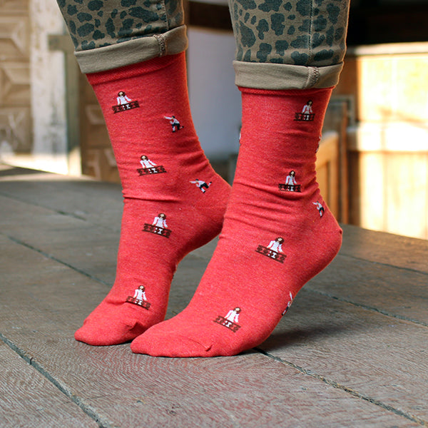 Red cotton blend socks with repeating images of Romeo kneeling and Juliet in her balcony