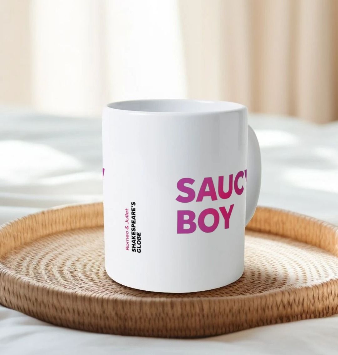 White mug with gradient dark to light pink text graphic in centre front, graphic repeated on both sides of the mug