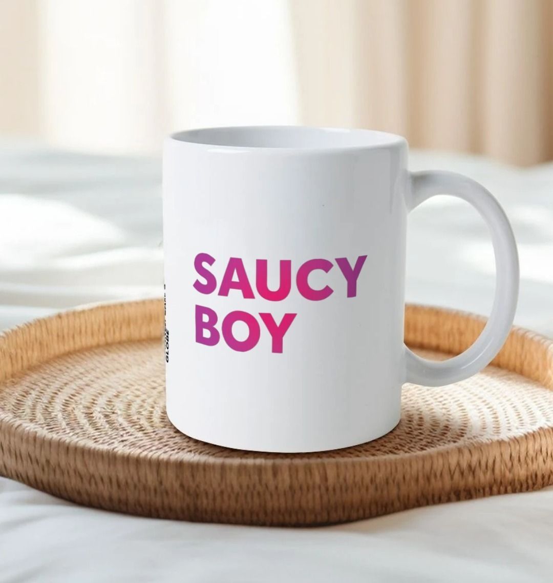 White mug with gradient dark to light pink text graphic in centre front, graphic repeated on both sides of the mug